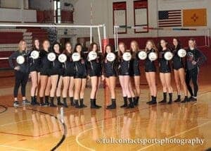 Girls volleyball team at Albuquerque Academy on the gym court.