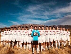 Albuquerque Academy soccer team outdoors in natural landscape for sports education and excellence.