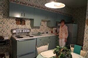 Vintage kitchen with floral wallpaper and retro appliances at Albuquerque Academy.