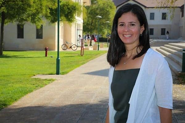Albuquerque Academy campus with smiling woman outdoors in New Mexico.