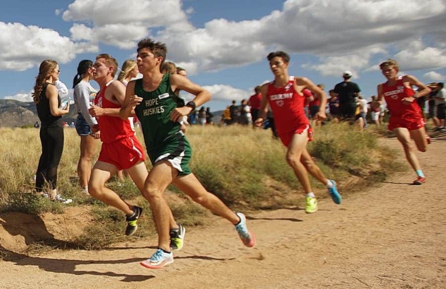 School cross country race on sunny day at Albuquerque Academy campus.