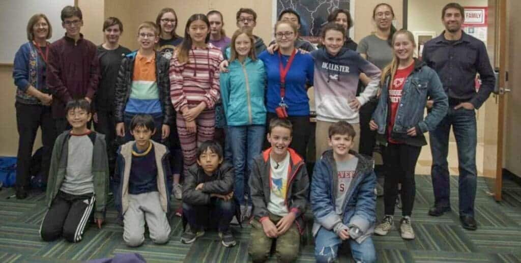 Diverse group of students and teachers at Albuquerque Academy, fostering academic excellence.