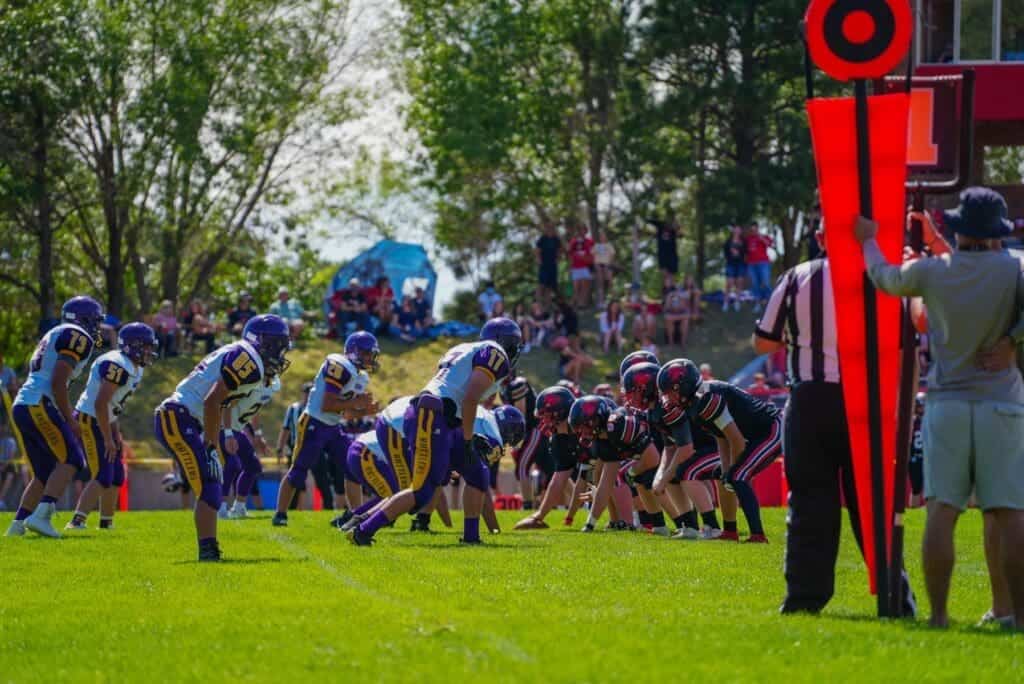 Youth football game at Albuquerque Academy football field.