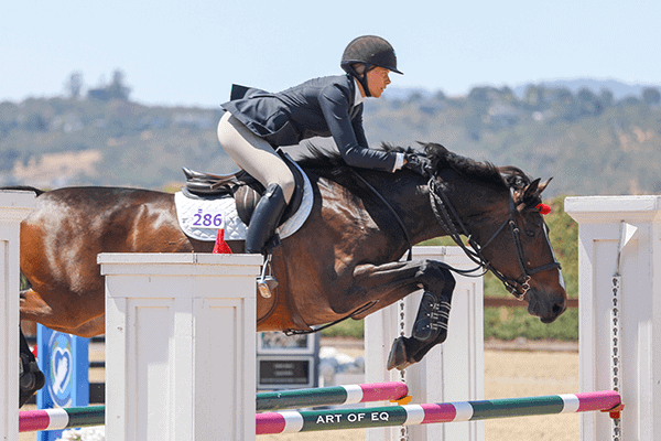 Equestrian student practicing jumping at Albuquerque Academy in New Mexico.