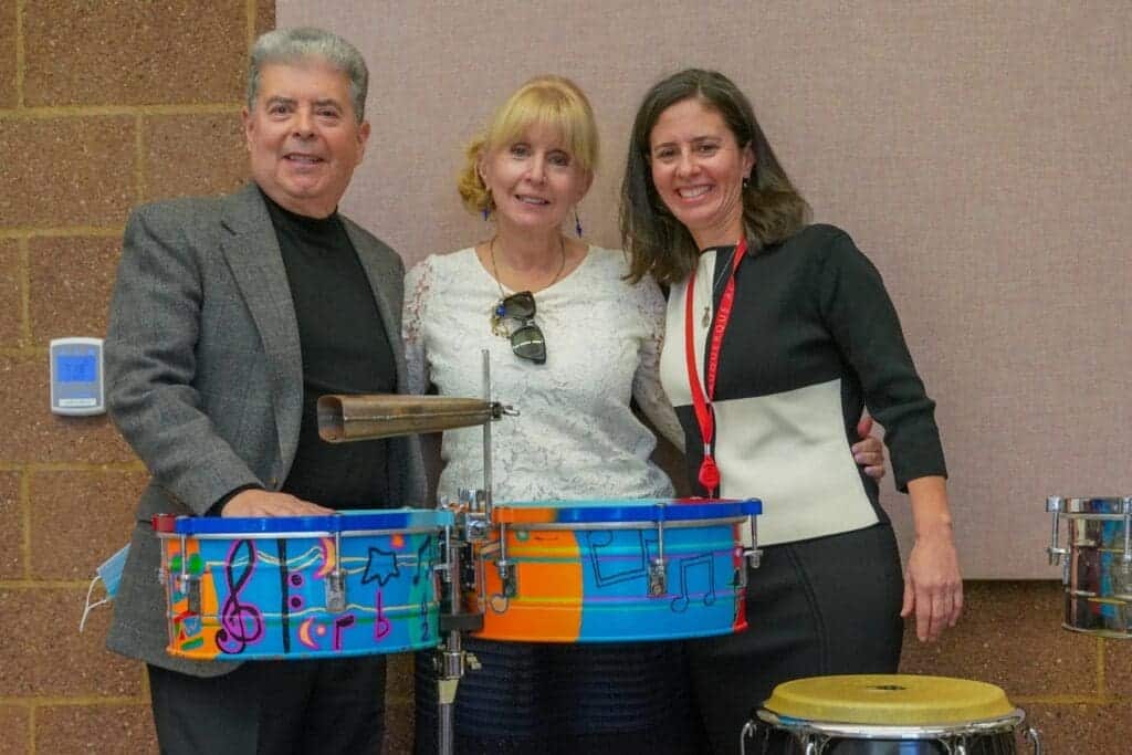 Colorful percussion drums at Albuquerque Academy music event, diverse community, talented students.