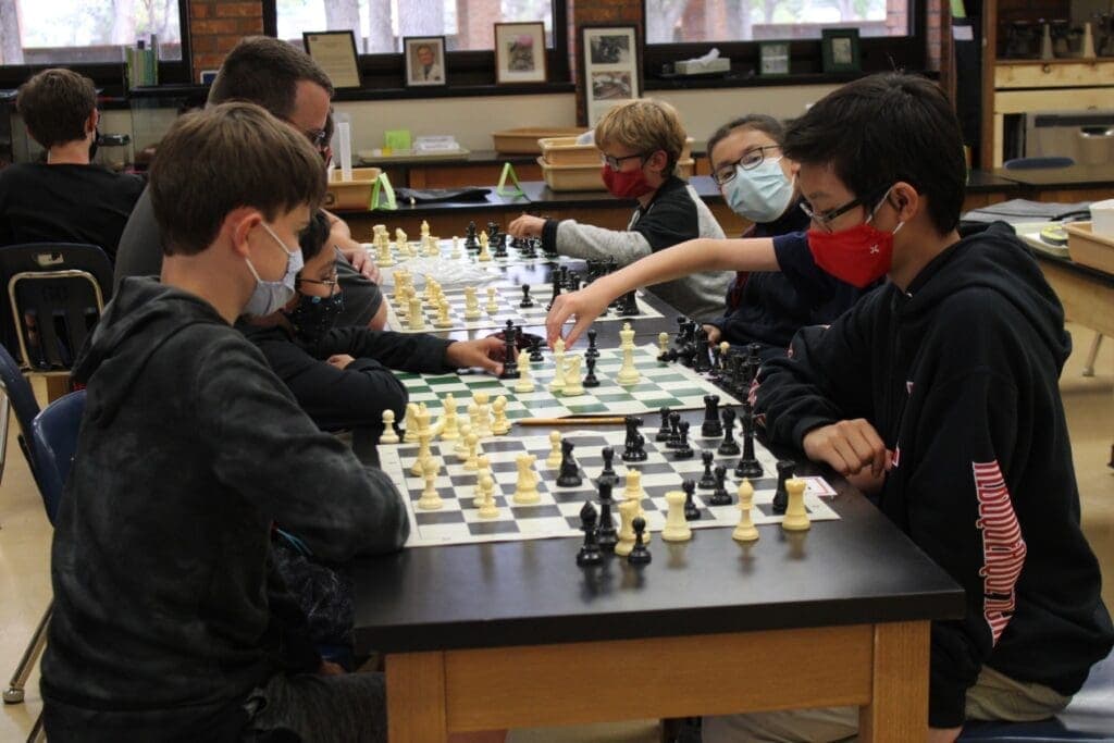 Students playing chess at Albuquerque Academy in a classroom.