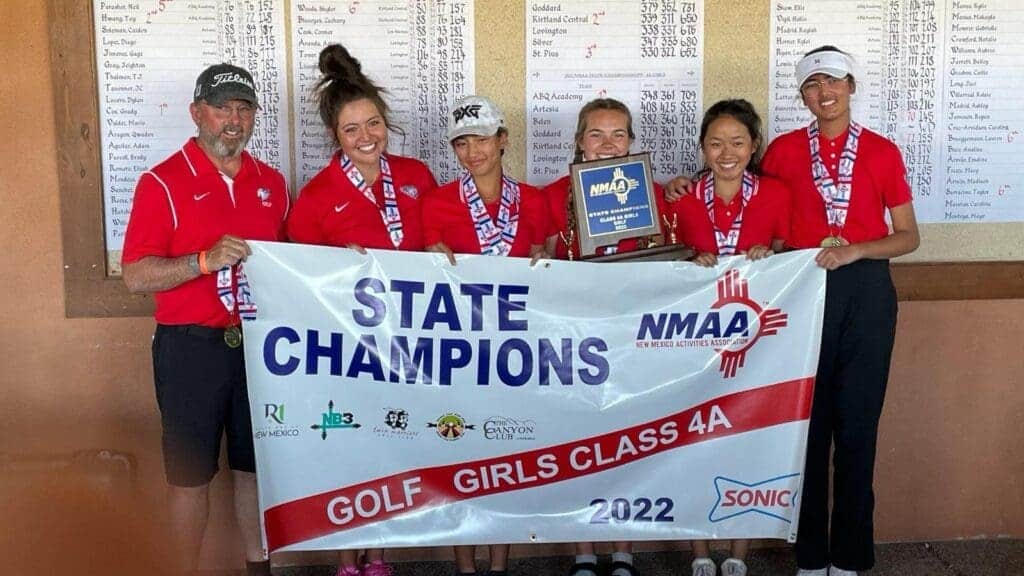 Albuquerque Academy girls golf team winning state championship, holding trophy with banner.