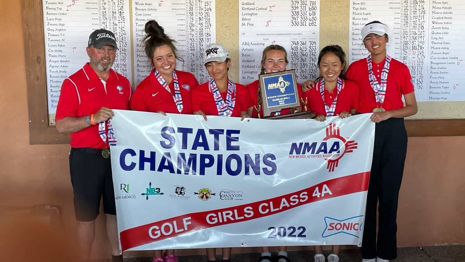 Albuquerque Academy girls golf team winning state championship, holding trophy with banner.