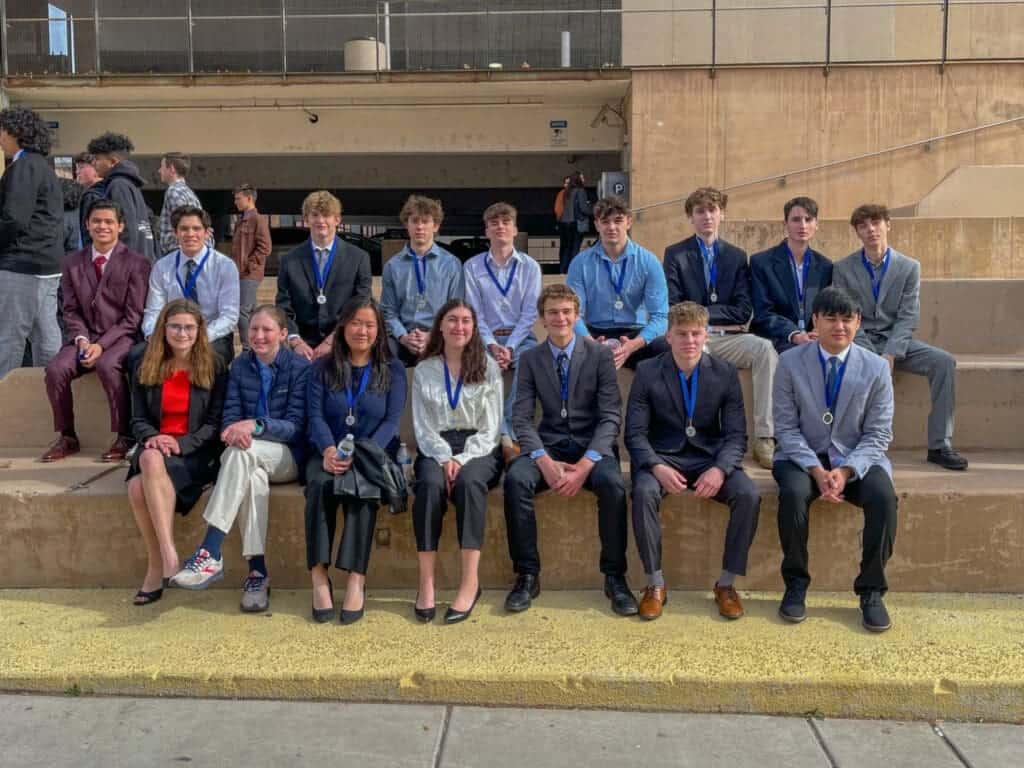 Medalist students at Albuquerque Academy awards ceremony outdoor event.