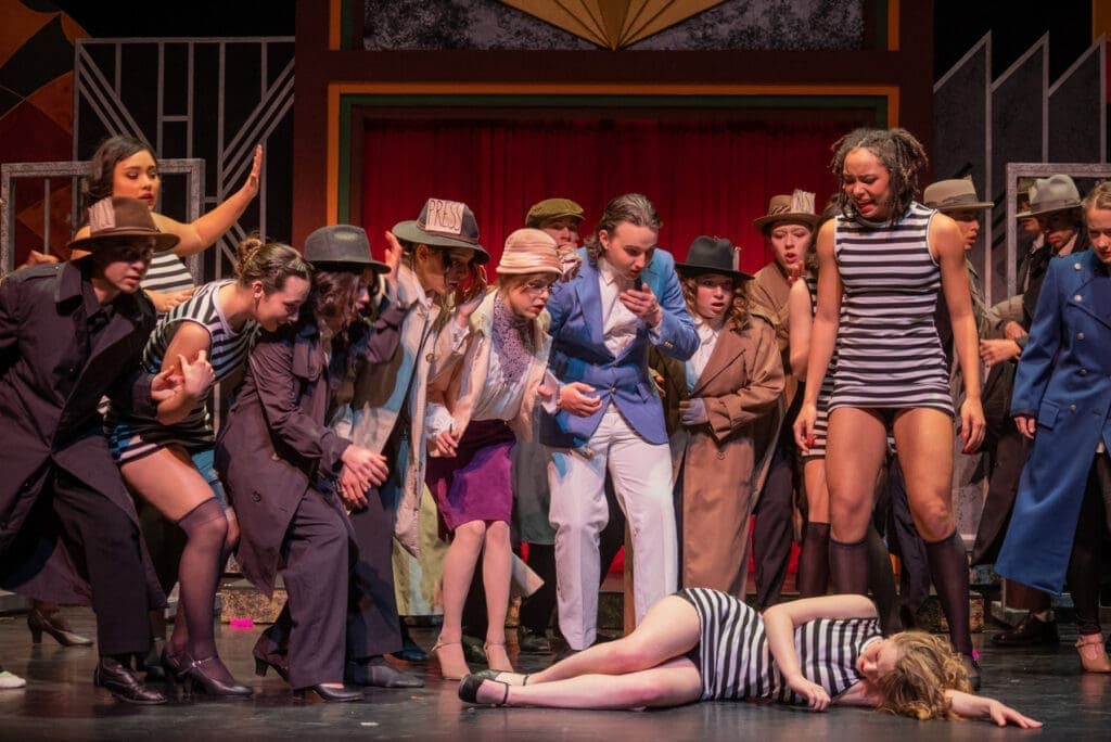 Teen actors performing on stage at Albuquerque Academy theater arts program.