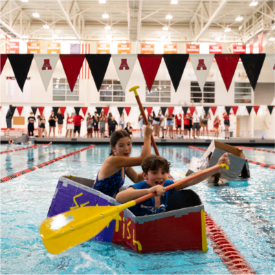 Children enjoying a swimming activity at Albuquerque Academy indoor pool.