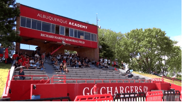 Albuquerque Academy Richard Harper Memorial Field with spectators on bleachers.