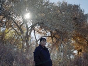 Albuquerque Academy student outdoors in autumn setting, scenic campus, top private school in New Mexico.
