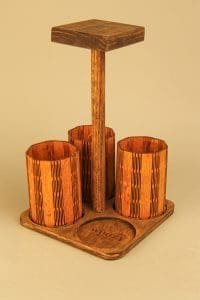 Wooden desk organizer for office or study, featuring three compartments and a top shelf for essentials.