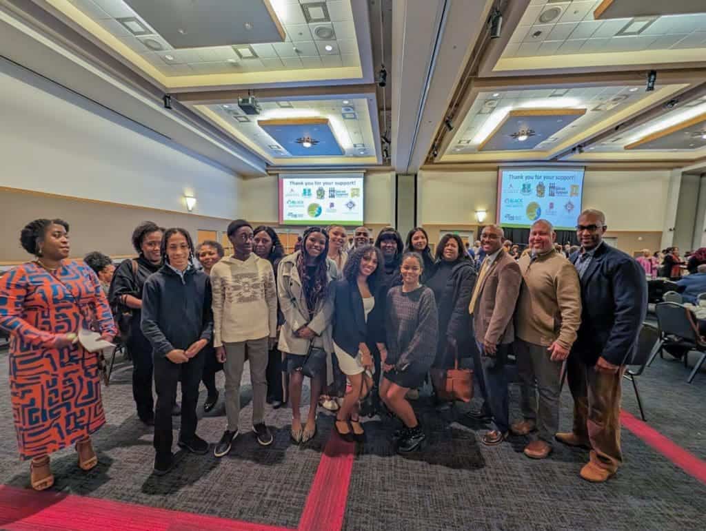 Albuquerque Academy students and staff gathered at a conference, showcasing diversity and academic excellence.