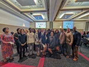 Albuquerque Academy students and staff gathered at a conference, showcasing diversity and academic excellence.