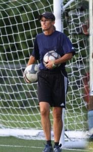 Experienced coach training students in soccer at Albuquerque Academy.
