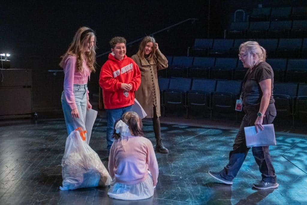 Students participating in a drama class at Albuquerque Academy, focusing on acting skills.