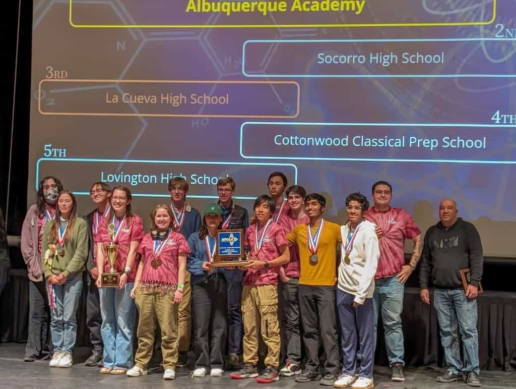 Innovative Albuquerque Academy high school students winning awards at a science competition.