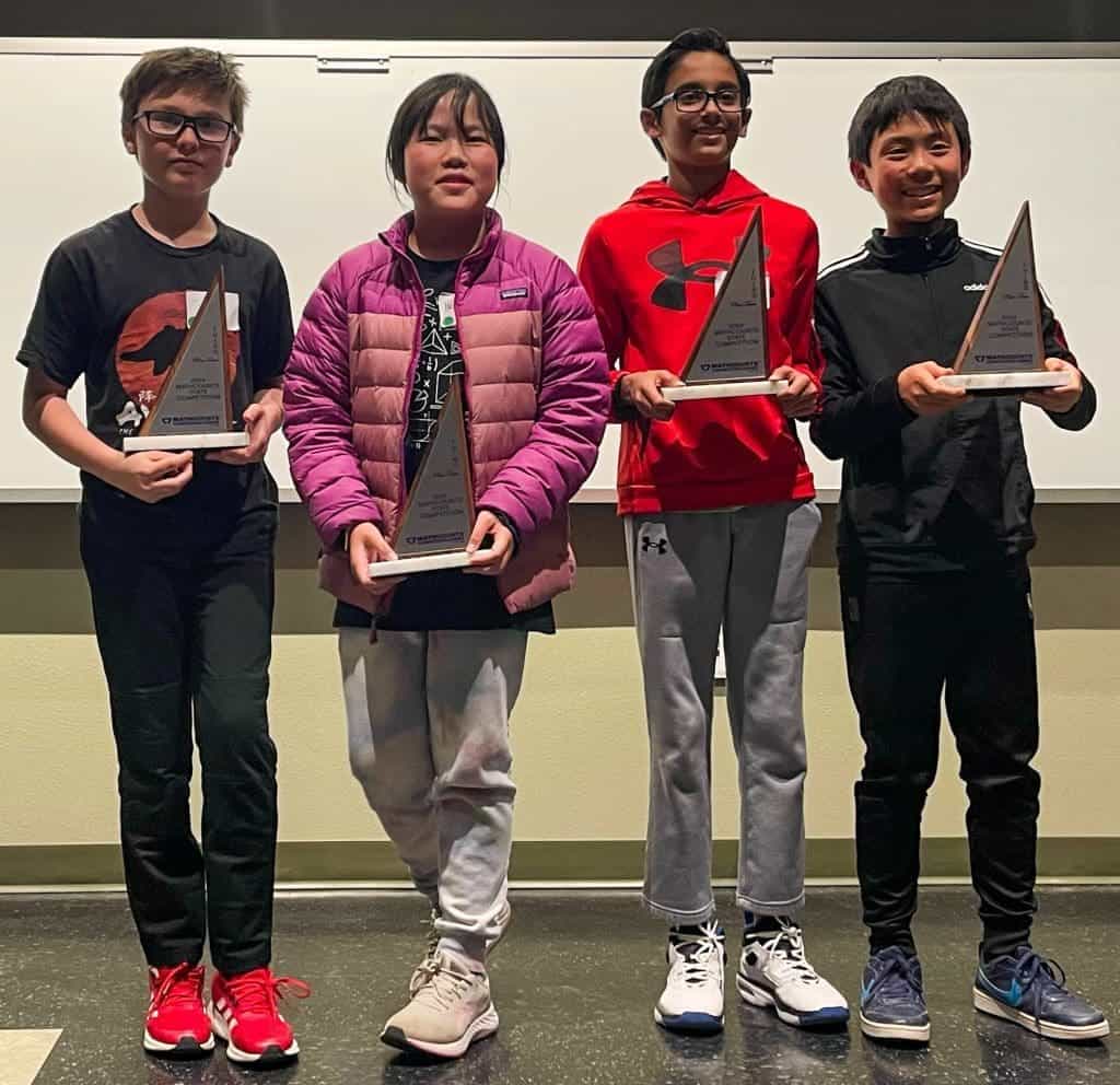 Bright young students receiving awards at Albuquerque Academy science competition.