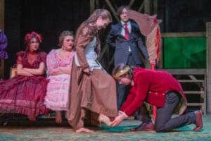Theater actors performing a Cinderella scene.