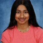 Diverse student smiling, representing Albuquerque Academy educational community.