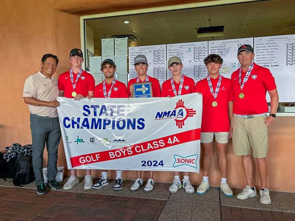 1. Albuquerque Academy golf team wins 2024 state championship, holding a large banner.