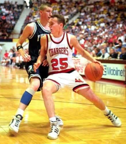 Albuquerque Academy basketball player in action during a game.