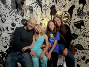 Family at Albuquerque Academy campus, diverse students and parents, engaging educational environment, creative artwork background.