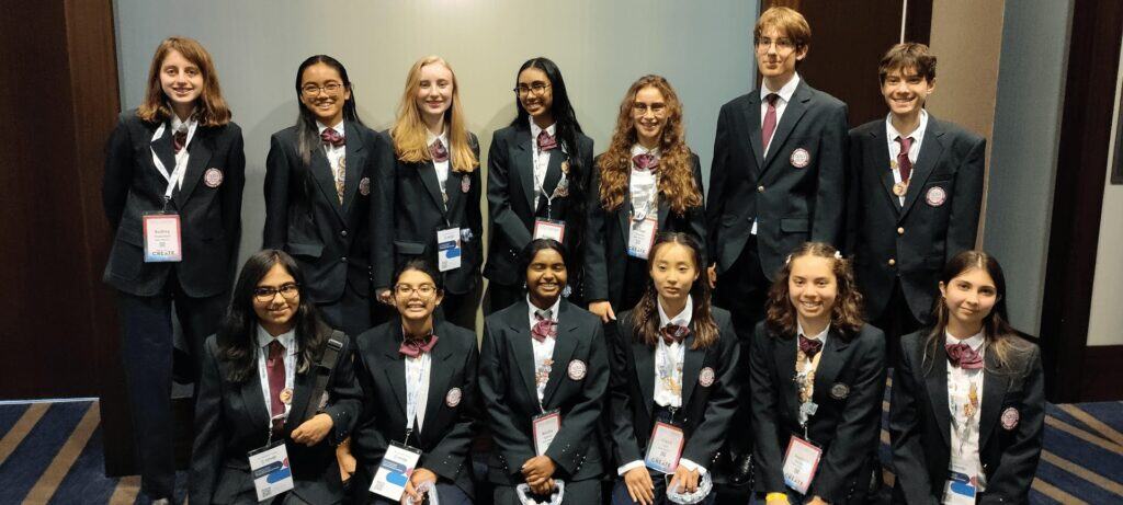 Diverse group of middle school students in formal attire at Albuquerque Academy conference.