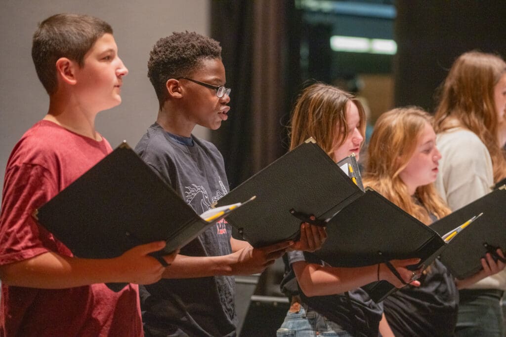 Students singing choir performance at Albuquerque Academy, showcasing arts education.