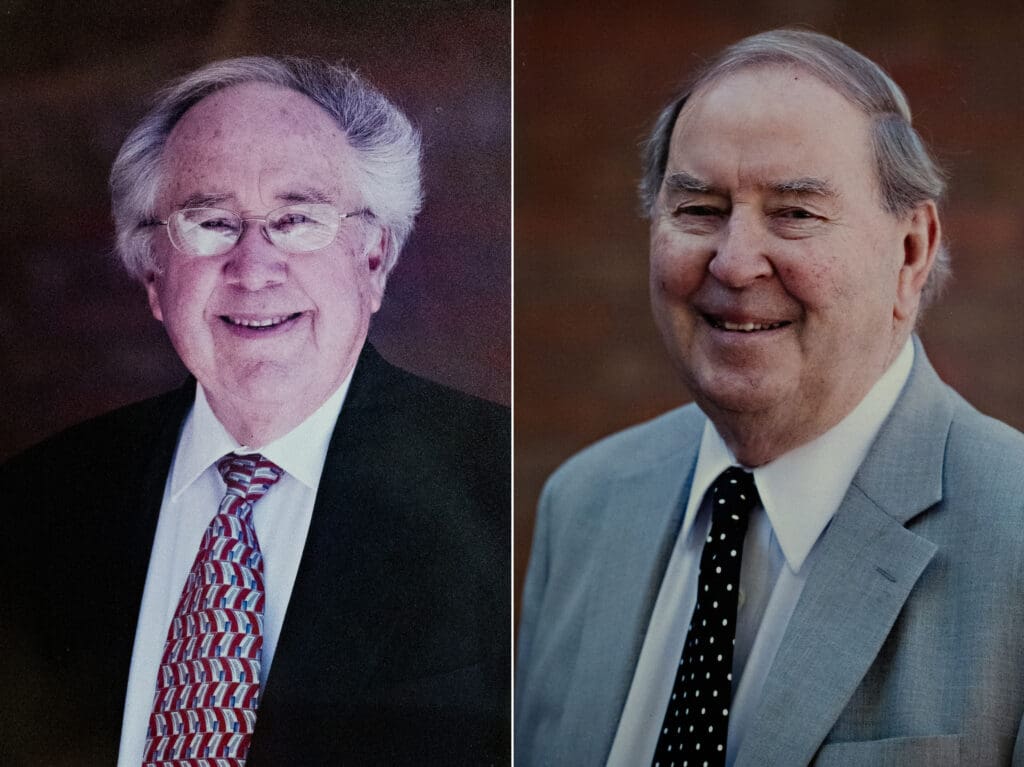 Professional portraits of two distinguished men in business suits at Albuquerque Academy.