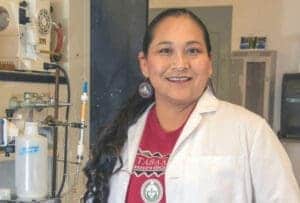 Albuquerque Academy science student in laboratory setting.