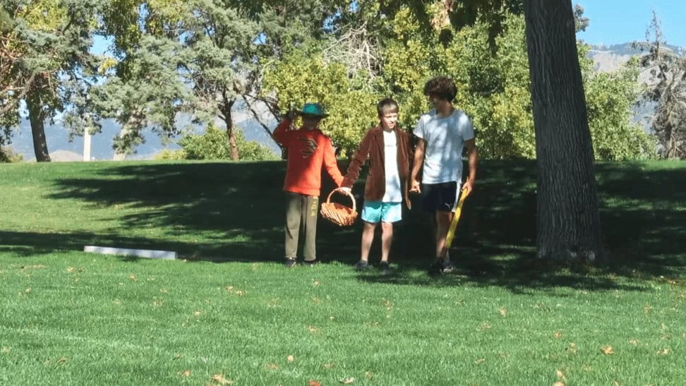 Children walking outdoors at Albuquerque Academy on a sunny day.