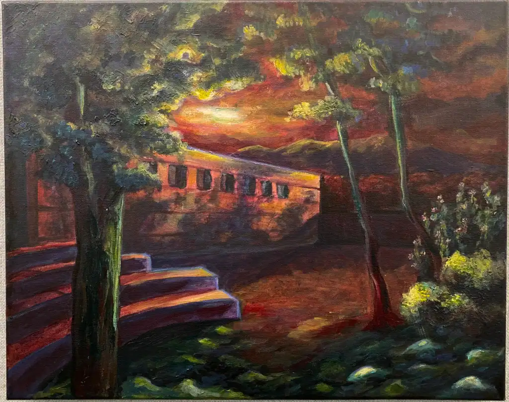 Albuquerque Academy campus at sunset with vibrant colors and lush trees.