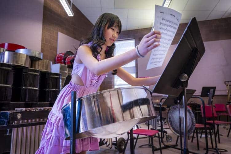 Albuquerque Academy student practicing music in a classroom setting.