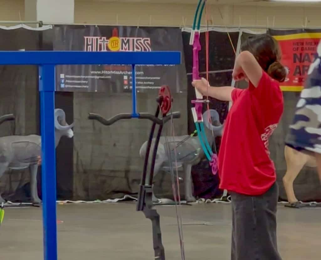 Archery student practicing at Albuquerque Academy during an archery event.