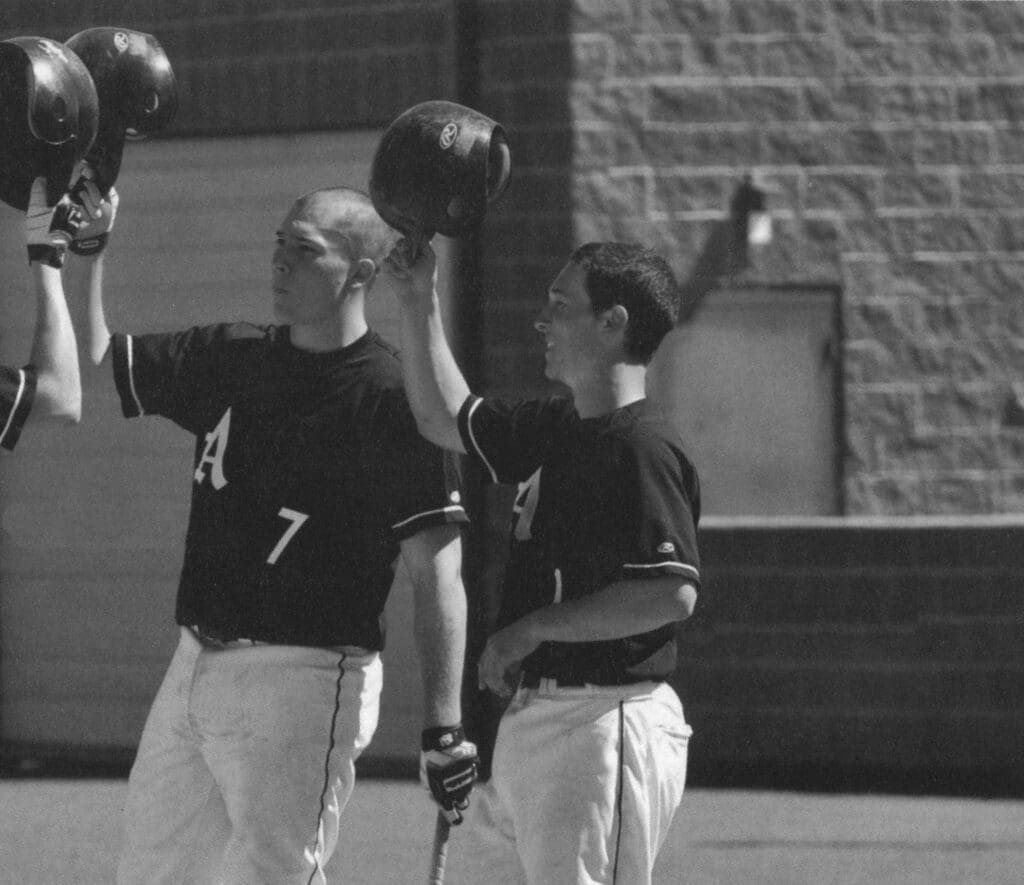 Albuquerque Academy student athletes practicing baseball skills outdoors.