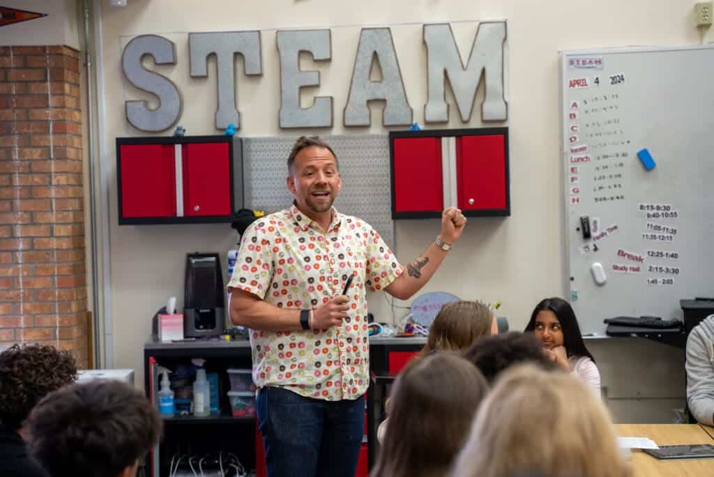 Innovative STEM teacher engaging students at Albuquerque Academy classroom.