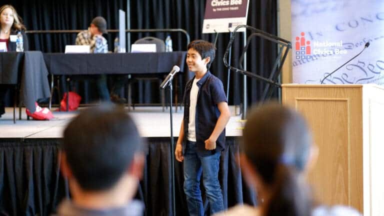 Albuquerque Academy student speaking at a school event.