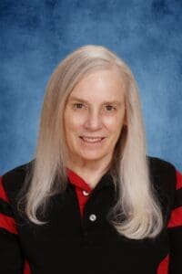 Experienced female faculty member at Albuquerque Academy with a warm smile.