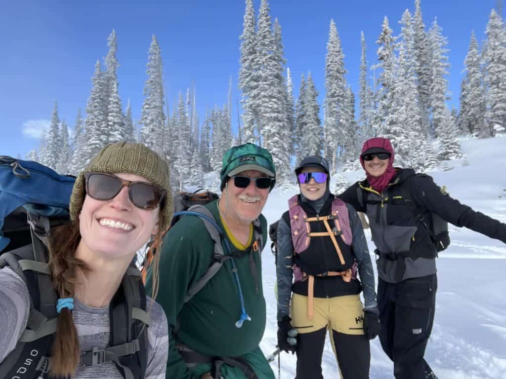 Albuquerque Academy students enjoying winter outdoor activities in a snowy mountain landscape.