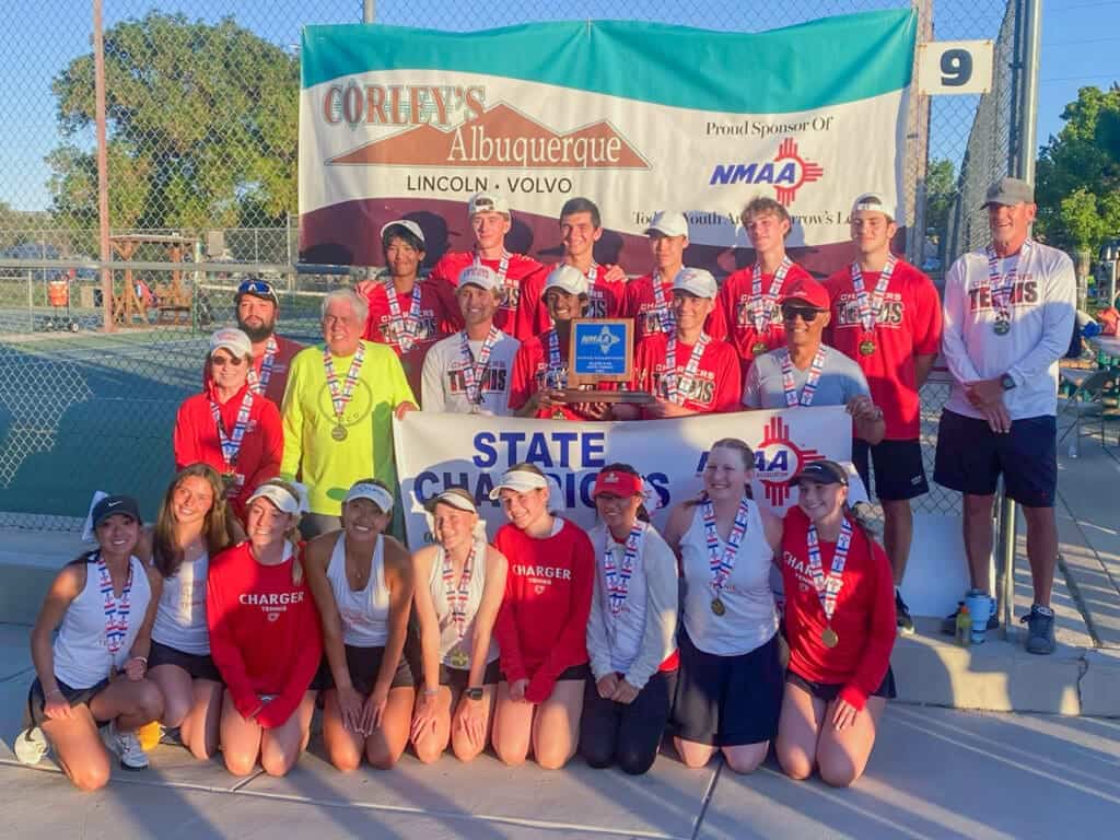 Albuquerque Academy tennis team celebrates state championship victory with medals and group photo.