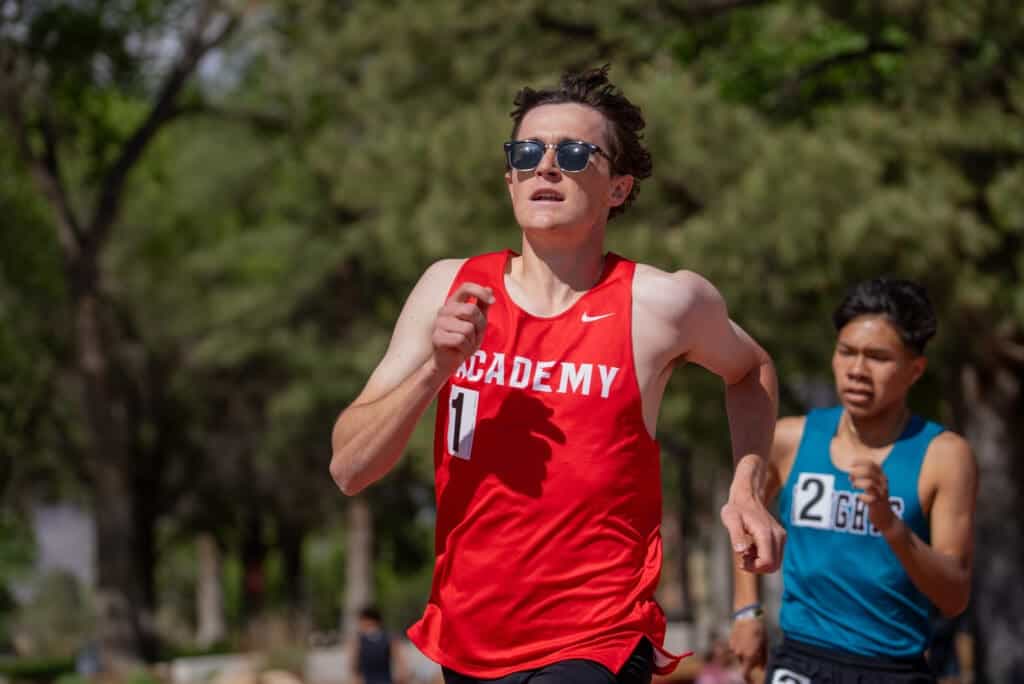 Running athletes competing in a cross-country race at Albuquerque Academy campus.