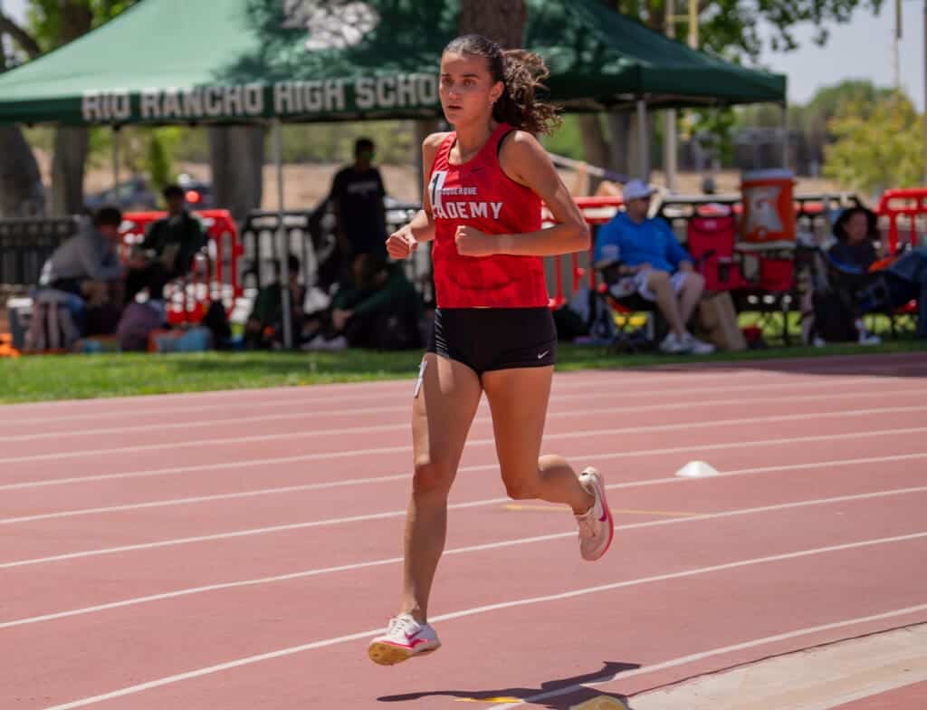 Albuquerque Academy student competing in track and field at Rio Rancho High School outdoor meet.