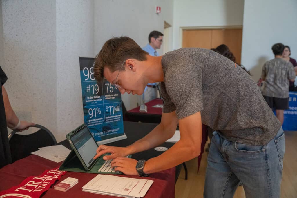 College fair student at Albuquerque Academy, exploring higher education opportunities.