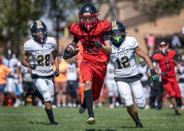 Albuquerque Academy football game featuring young athletes in action, emphasizing sportsmanship, teamwork, and athletic excellence at the renowned Albuquerque private school.