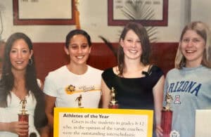 Albuquerque Academy students winning athletes of the year award at a recognition event.
