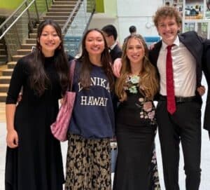 Albuquerque Academy students smiling together in a school hallway.
