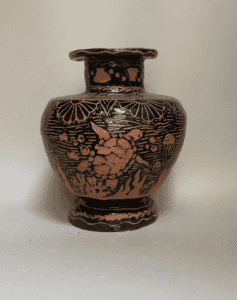 Colorful ceramic vase with ocean and turtle design, handcrafted art piece.